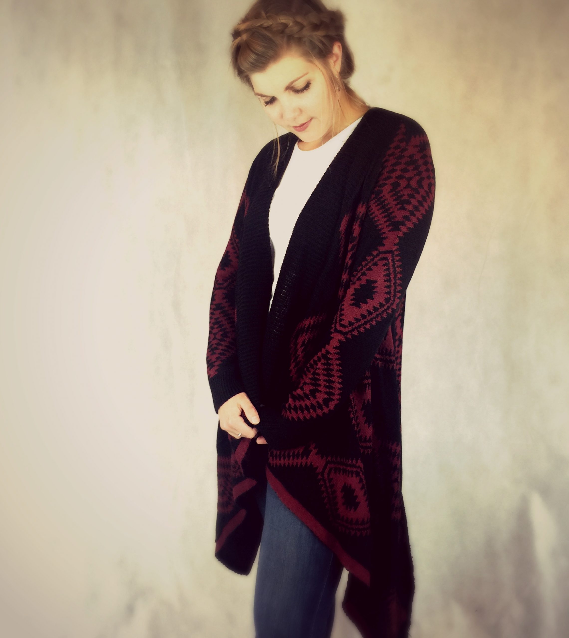 Ladies long length poncho style chunky cardigan in burgundy and black aztec knit Ladies long length poncho style chunky cardigan in burgundy and black aztec knit